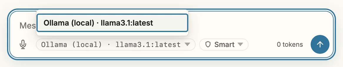 The message field with the model pill “Ollama (local) · llama3.1:latest” opened: a menu above it lists the entry “Ollama (local) · llama3.1:latest”. Next to the pill the mode “Smart”, on the right “0 tokens” and the send button.